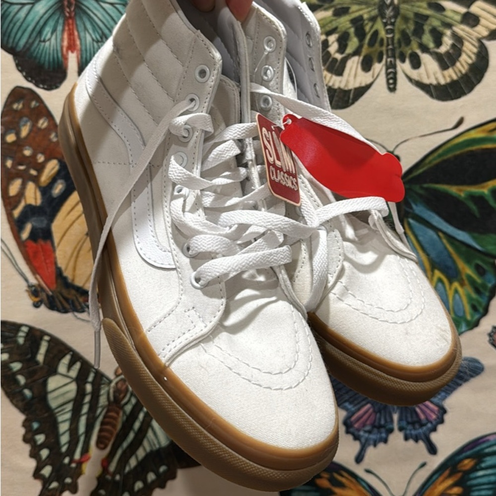 White canvas Vans Sk8hi sneaker with gum sole